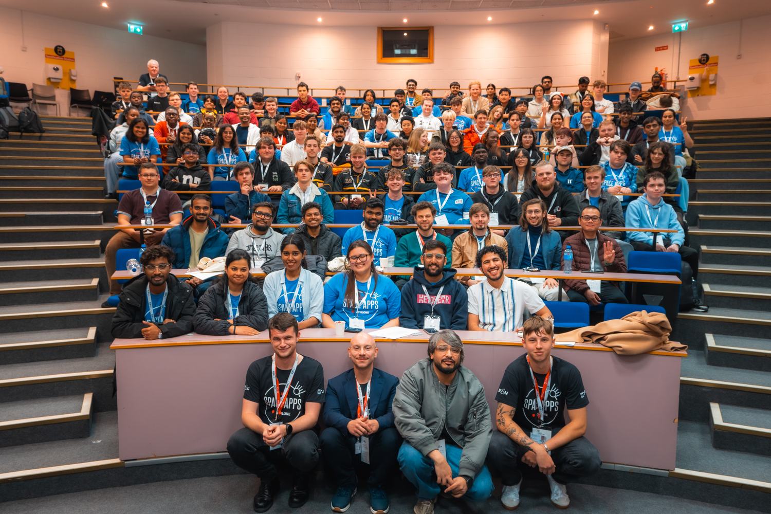 The main hall during HackAthlone, with teams working at long tables.