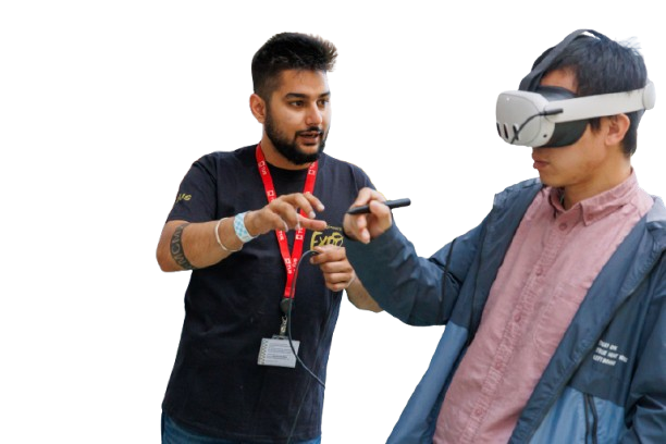 Sahir Sharma guiding a participant wearing a mixed reality headset through a stylus based design review.